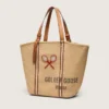 24,7 Tote aus naturbelassener Raffia und braunem Leder mit goldenen Metalldetails