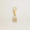 Anhänger in Form eines Schlosses aus goldfarbenem Messing mit Kristallen