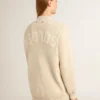 Beigefarbene Damen-Strickjacke mit „Golden“-Schriftzug auf der Rückseite