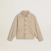 Beigefarbene Kinderjacke mit bunten Farbtupfern