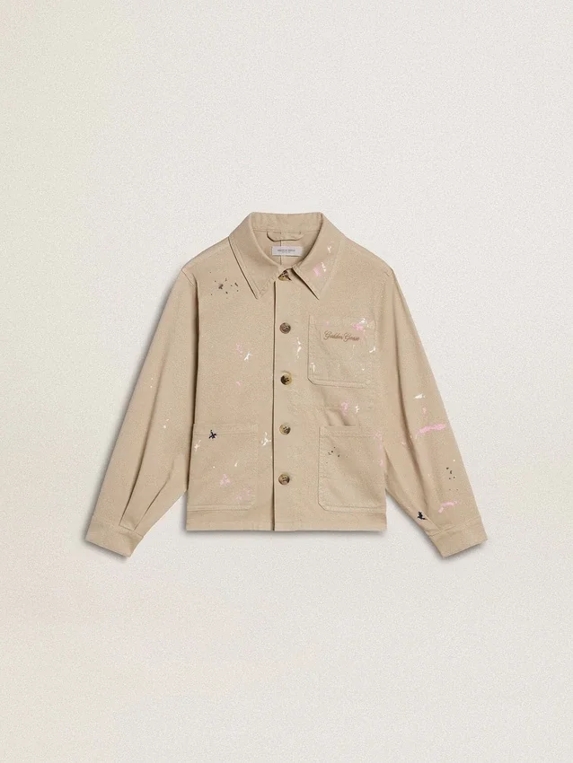 Beigefarbene Kinderjacke mit bunten Farbtupfern