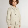 Beigefarbene Kinderjacke mit bunten Farbtupfern