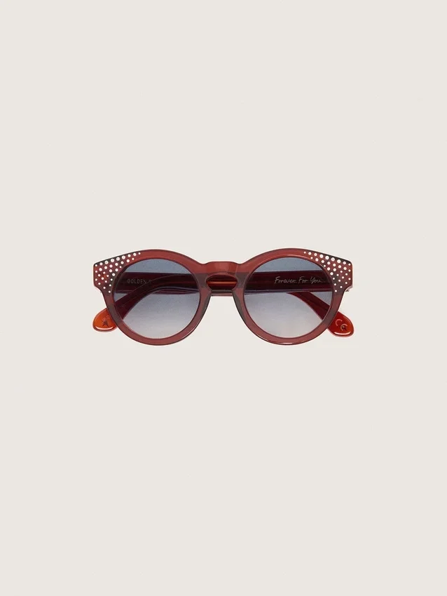 Cameron Panthos Sonnenbrille mit honigfarbenem Rahmen, Edelsteinen und blauen Gläsern