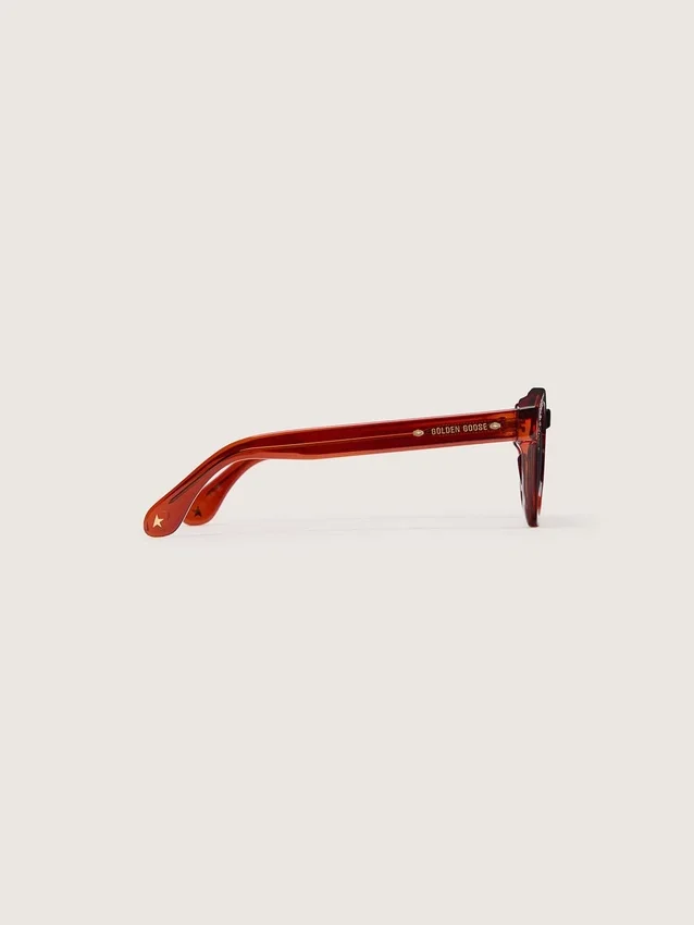 Cameron Panthos Sonnenbrille mit honigfarbenem Rahmen, Edelsteinen und blauen Gläsern