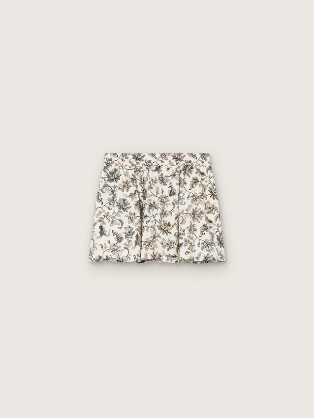 „Journey“-Minirock für Mädchen aus weißem Baumwoll-Canvas mit grünem Blumenprint