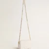 Mini Star Bag aus butterweißem Leder mit Ton-in-Ton-Stern