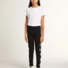 Schwarze Leggings für Mädchen mit weißen Sternen an den Seiten