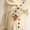 Weißes Damen-Sweatshirt mit Reißverschluss, weißem Streifen und schwarzen Sternen